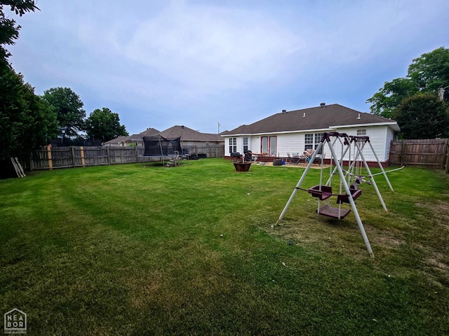 243 N Oak St, Brookland, AR 72417 - fenced backyard with a trampoline