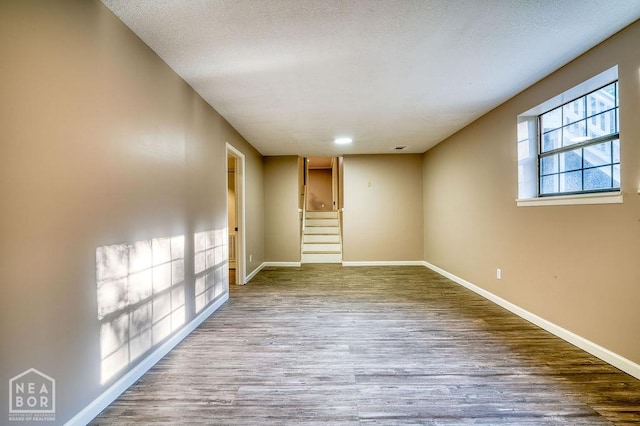 1610 Smoot Dr, Jonesboro, AR 72401 - spare room with wood finished floors and stairway