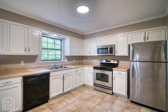 1610 Smoot Dr, Jonesboro, AR 72401 - kitchen featuring stainless steel appliances, white cabinetry, a textured ceiling, crown molding, and light tile patterned flooring