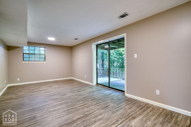1610 Smoot Dr, Jonesboro, AR 72401 - spare room with baseboards and wood finished floors