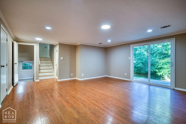 1610 Smoot Dr, Jonesboro, AR 72401 - spare room with ornamental molding, light wood finished floors, stairs, and recessed lighting