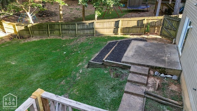 1610 Smoot Dr, Jonesboro, AR 72401 - fenced backyard featuring a patio area and a trampoline