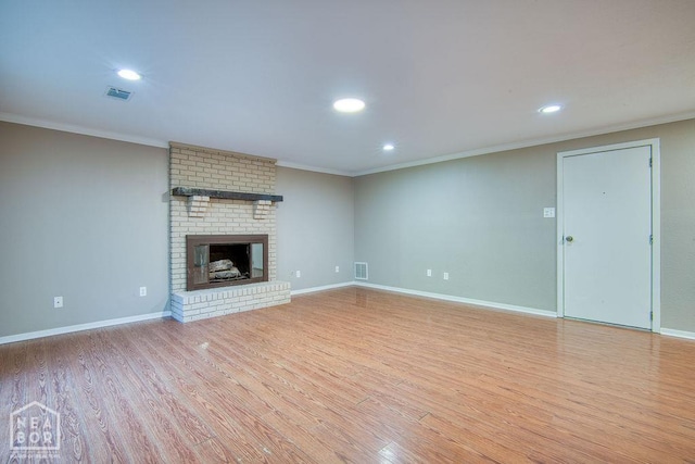 1610 Smoot Dr, Jonesboro, AR 72401 - unfurnished living room with ornamental molding, wood finished floors, recessed lighting, and a fireplace
