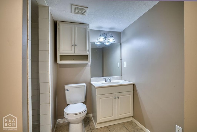 1610 Smoot Dr, Jonesboro, AR 72401 - bathroom with vanity, tile patterned flooring, and a textured ceiling