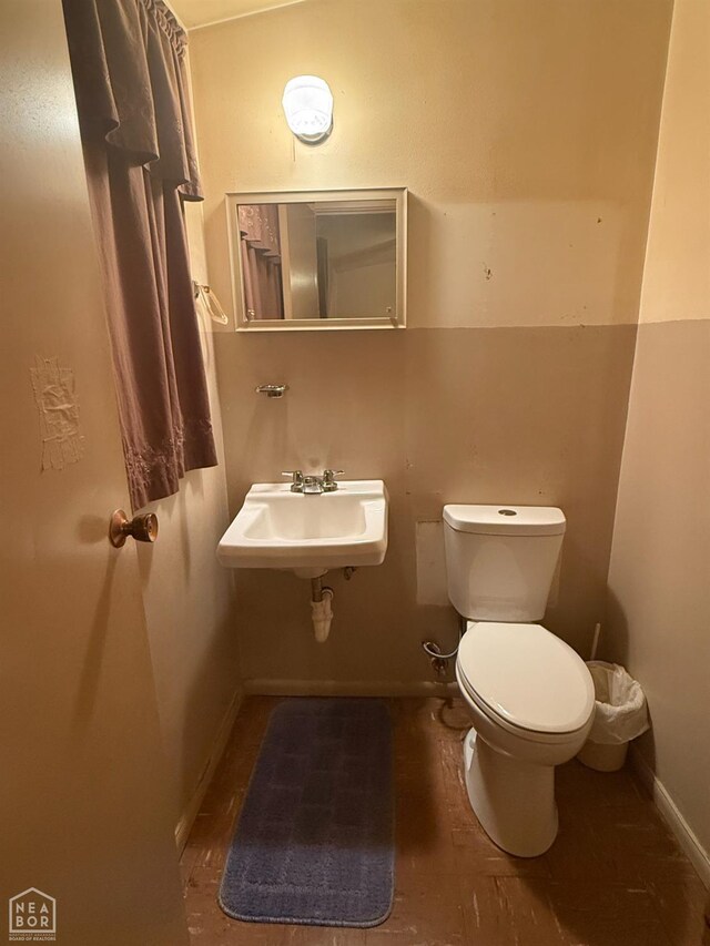 209 W Easy St, Jonesboro, AR 72401 - half bathroom with toilet, a sink, and baseboards