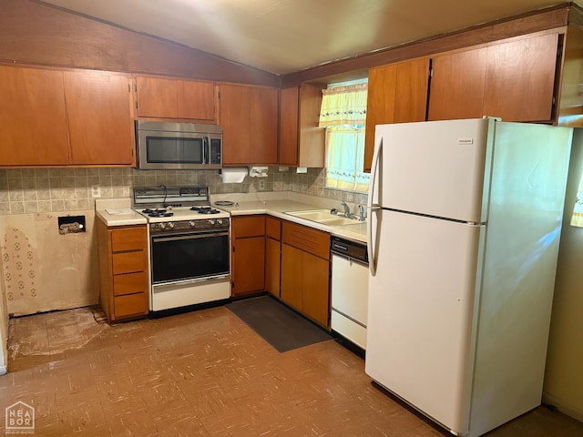 209 W Easy St, Jonesboro, AR 72401 - kitchen featuring white appliances, a sink, lofted ceiling, tile patterned floors, and light countertops