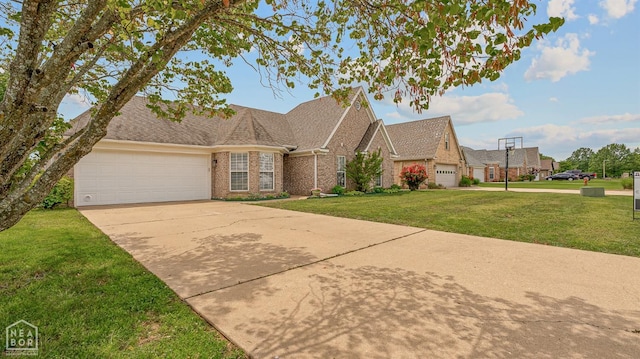 view of front facade with brick siding, a shingled roof, driveway, a front yard, and an attached garage