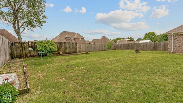 view of yard with a fenced backyard