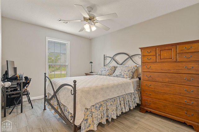 bedroom with baseboards, light wood-type flooring, and ceiling fan