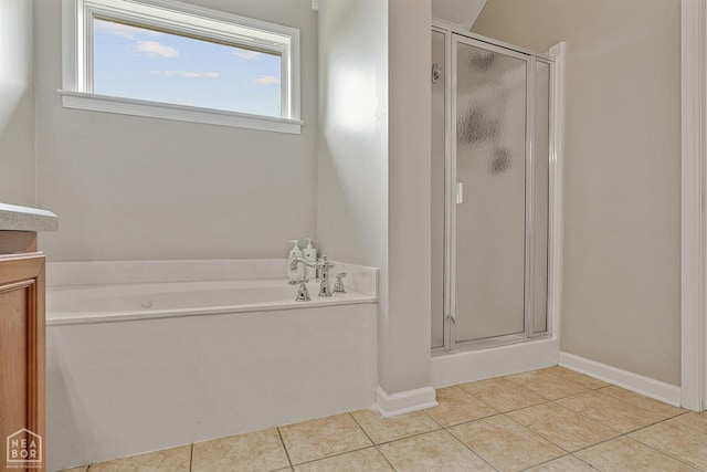 full bath with tile patterned floors, a garden tub, a shower stall, and vanity