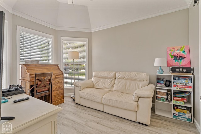 office with ornamental molding, light wood-style flooring, and baseboards