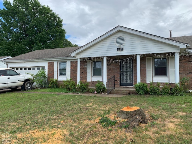 single story home with brick siding, an attached garage, and a front yard