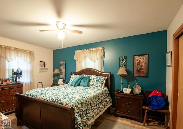 bedroom featuring wood finished floors and a ceiling fan