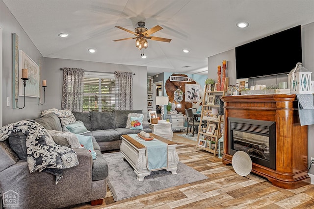 2708 N 5th St, Paragould, AR 72450 - living room with a ceiling fan, light wood-style floors, a glass covered fireplace, and recessed lighting