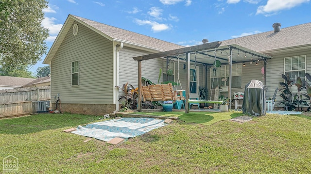 2708 N 5th St, Paragould, AR 72450 - back of house featuring cooling unit, roof with shingles, and a patio area