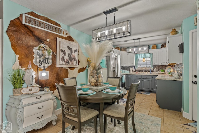 2708 N 5th St, Paragould, AR 72450 - dining room with light tile patterned floors and a chandelier