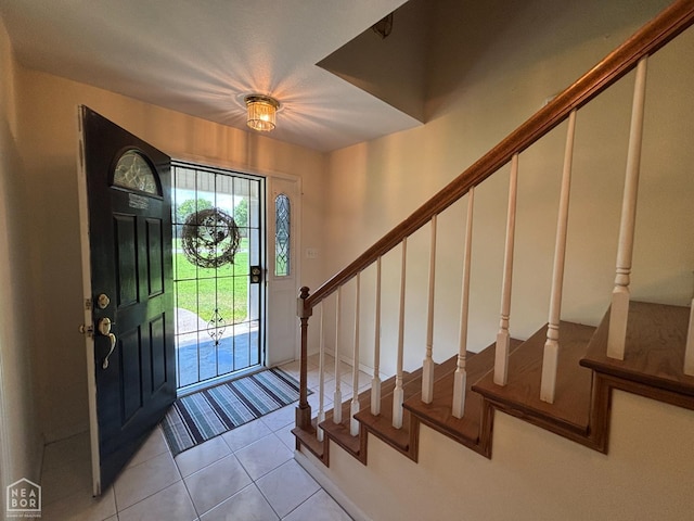 100 Charleston Dr, Walnut Ridge, AR 72476 - entryway featuring stairway and light tile patterned flooring