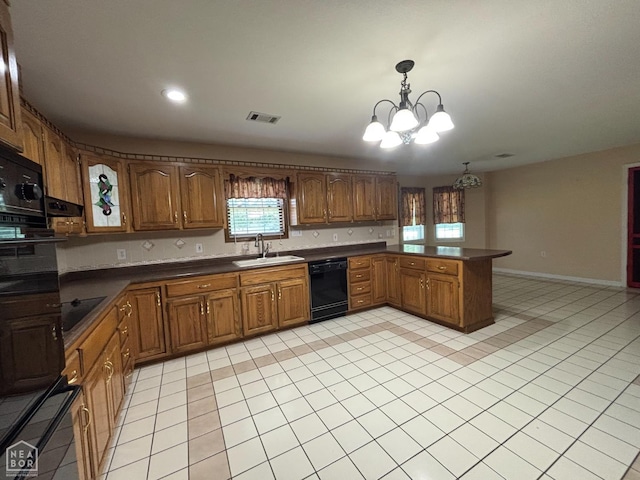 100 Charleston Dr, Walnut Ridge, AR 72476 - kitchen featuring a chandelier, dark countertops, black appliances, brown cabinets, and a peninsula