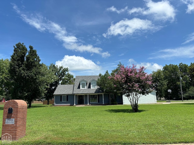 100 Charleston Dr, Walnut Ridge, AR 72476 - view of front facade featuring a front lawn, a porch, roof with shingles, and a garage