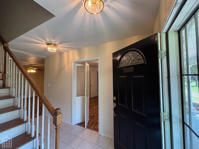 100 Charleston Dr, Walnut Ridge, AR 72476 - entryway with light tile patterned flooring, stairs, and a ceiling fan