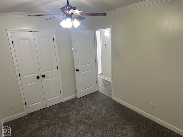 107 Esker Dr, Osceola, AR 72370 - unfurnished bedroom with crown molding, dark carpet, baseboards, a closet, and ceiling fan