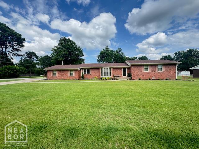 700 11th St, Corning, AR 72422 - ranch-style home with a front lawn and brick siding