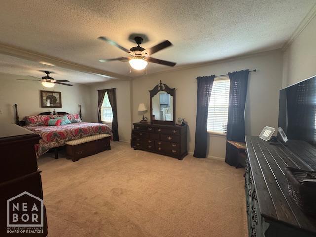700 11th St, Corning, AR 72422 - bedroom with multiple windows, light carpet, a textured ceiling, a ceiling fan, and crown molding