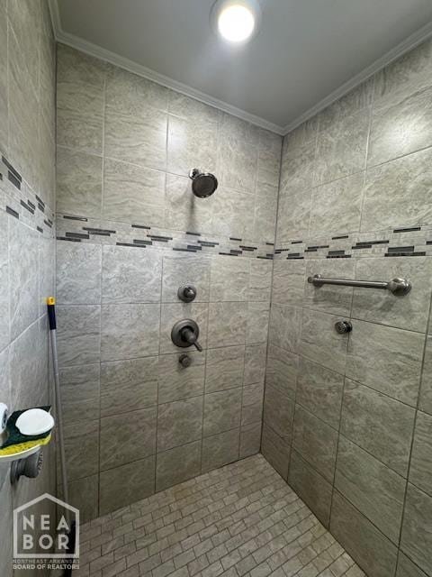 700 11th St, Corning, AR 72422 - full bathroom with crown molding and tiled shower
