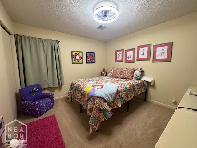 700 11th St, Corning, AR 72422 - bedroom with carpet flooring and a textured ceiling