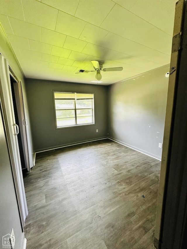 509 NE 4thw, Walnut Ridge, AR 72476 - empty room featuring a ceiling fan and wood finished floors