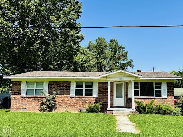 509 NE 4thw, Walnut Ridge, AR 72476 - ranch-style home with brick siding, a front yard, and crawl space