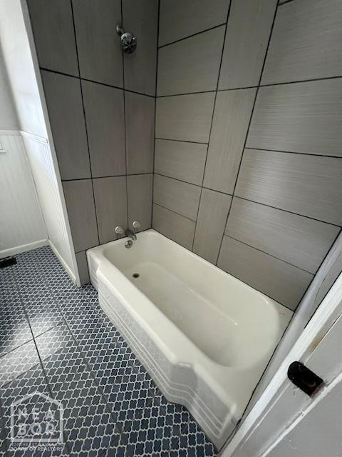 304 S 11th Ave S, Paragould, AR 72450 - bathroom featuring tub / shower combination and tile patterned flooring