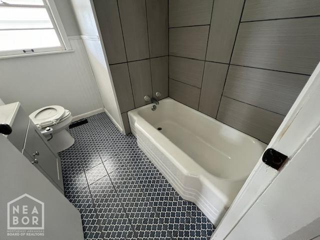 304 S 11th Ave S, Paragould, AR 72450 - full bath featuring vanity, tile patterned floors, and shower / bath combination