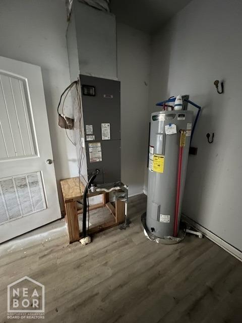 utility room featuring electric water heater