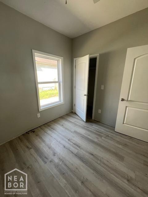 unfurnished bedroom featuring wood finished floors