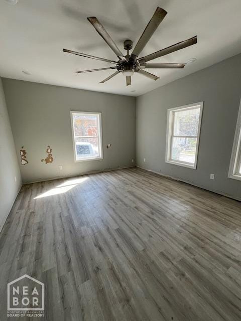 spare room with ceiling fan and wood finished floors