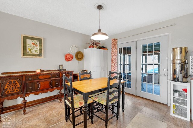 154 Mockingbird Cir, Marmaduke, AR 72443 - dining room with french doors and light tile patterned flooring