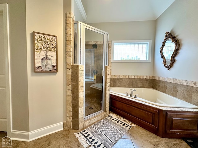 full bathroom with tile patterned floors, a garden tub, and a stall shower