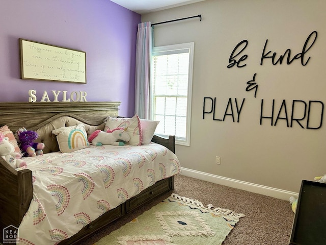 carpeted bedroom with baseboards