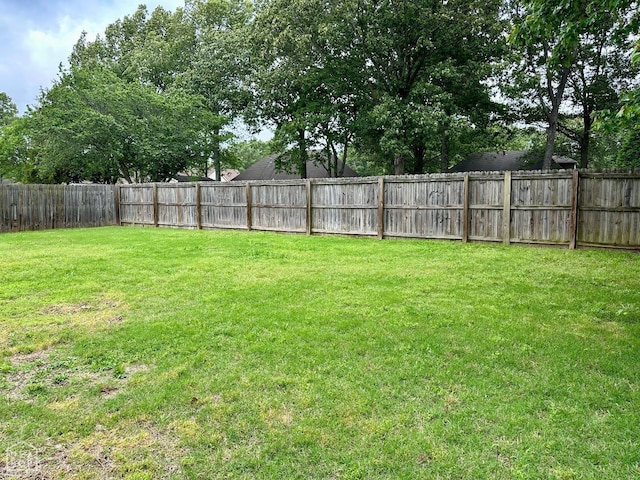 view of yard with a fenced backyard