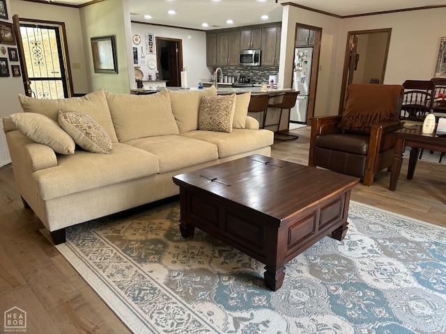 700 Oak Hollow Ln, Jonesboro, AR 72401 - living area with crown molding, light wood finished floors, and recessed lighting