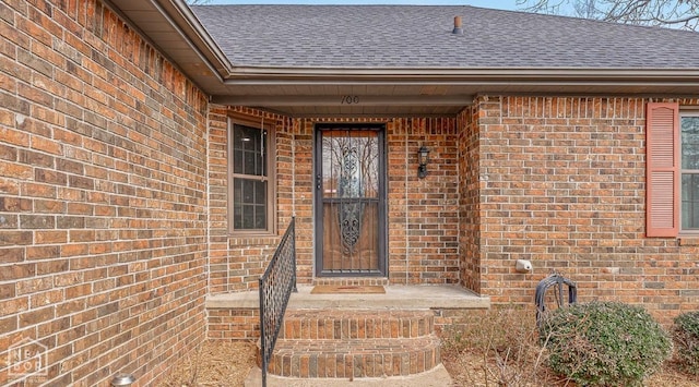 700 Oak Hollow Ln, Jonesboro, AR 72401 - property entrance featuring a shingled roof and brick siding