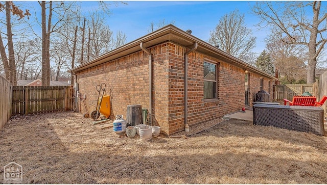 700 Oak Hollow Ln, Jonesboro, AR 72401 - view of home's exterior featuring brick siding and a fenced backyard
