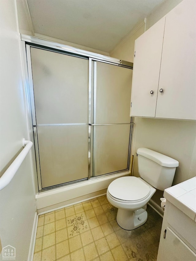 320 Church, Weiner, AR 72479 - full bathroom with baseboards, a shower with shower door, vanity, and toilet