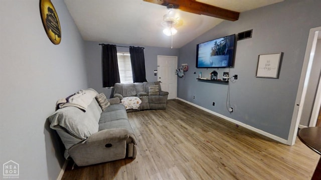 living room with visible vents, wood finished floors, baseboards, and lofted ceiling with beams