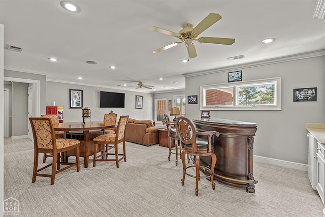dining area with recessed lighting, crown molding, light carpet, a ceiling fan, and baseboards