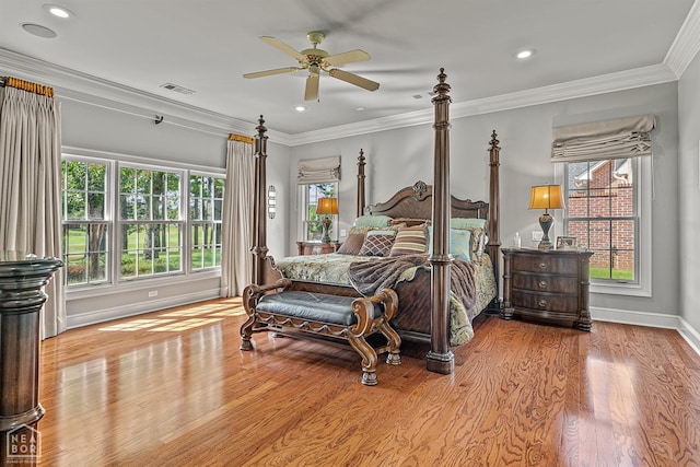 bedroom with wood finished floors, baseboards, crown molding, recessed lighting, and ceiling fan
