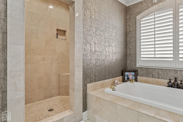 full bath featuring a garden tub and a tile shower