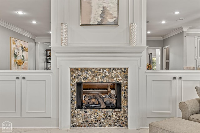 detailed view of crown molding, a fireplace, and recessed lighting