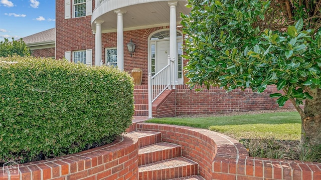 property entrance with brick siding